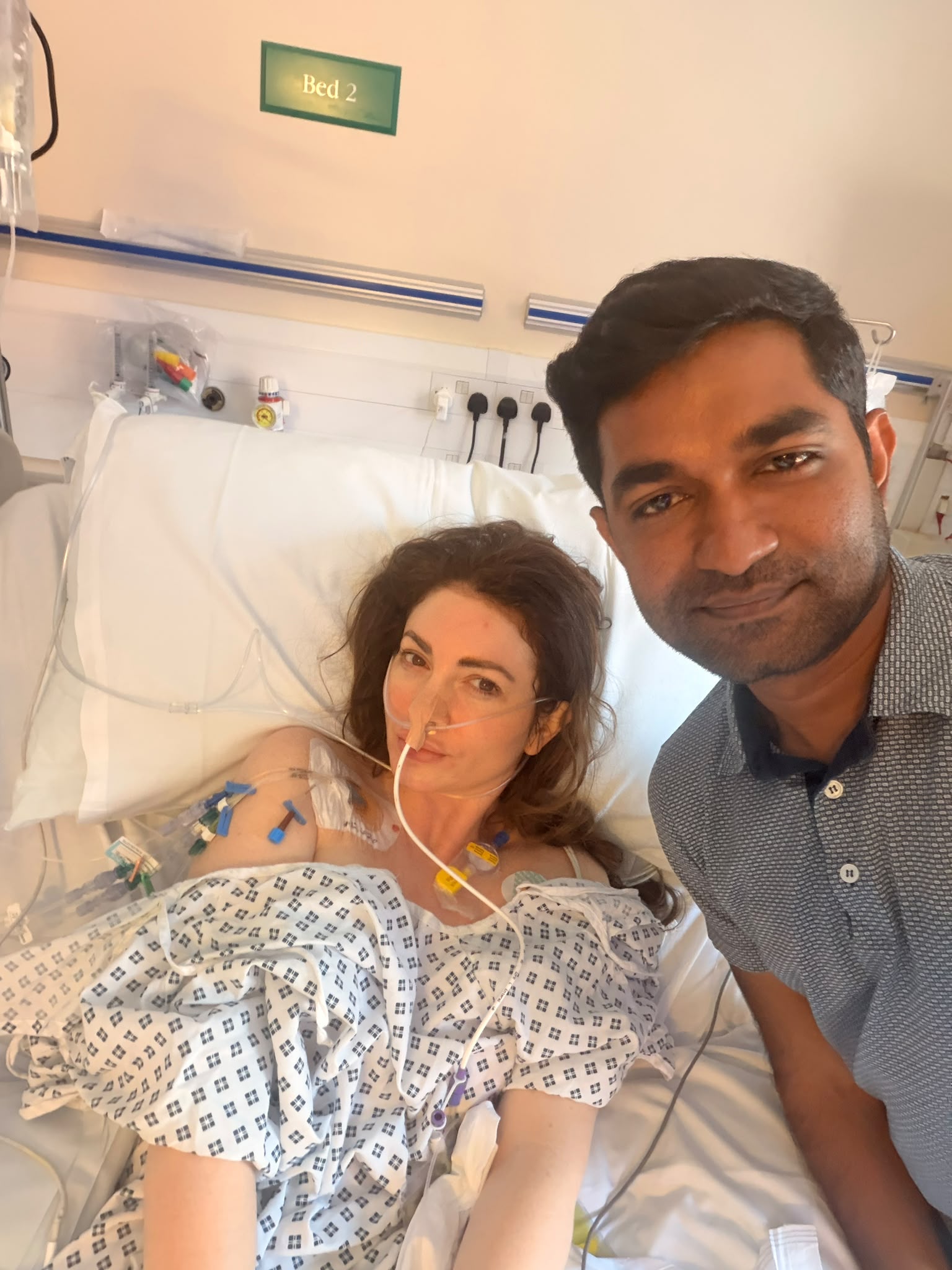 Elle with a friend visiting in hospital